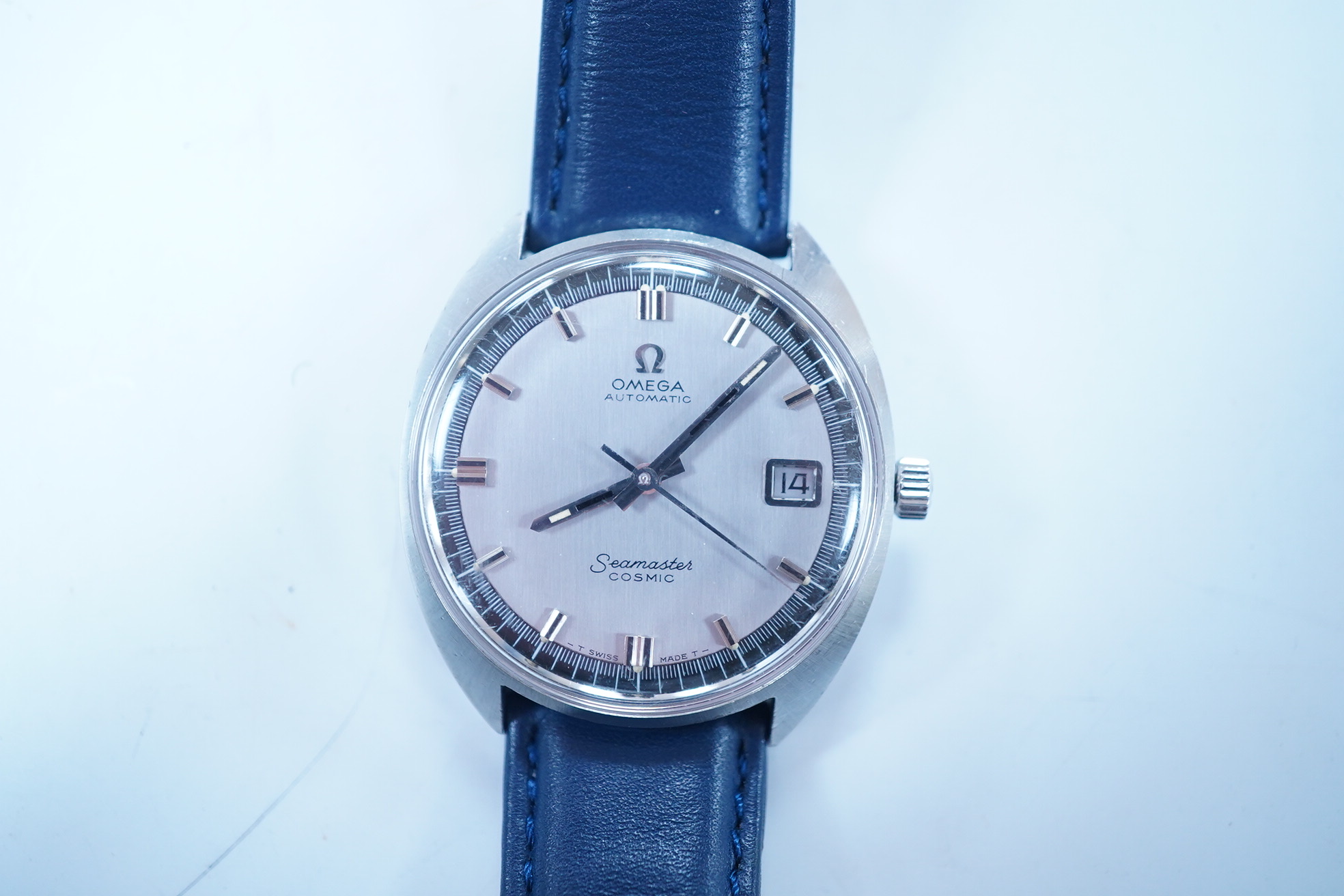 A gentleman's stainless steel Omega Seamaster Cosmic Automatic wrist watch, with baton numerals and date aperture, case diameter 35mm, on a later associated leather strap. Condition - fair